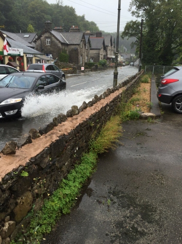 Photo attached of flooding on Windermere Road, Grange over Sands in August 2016